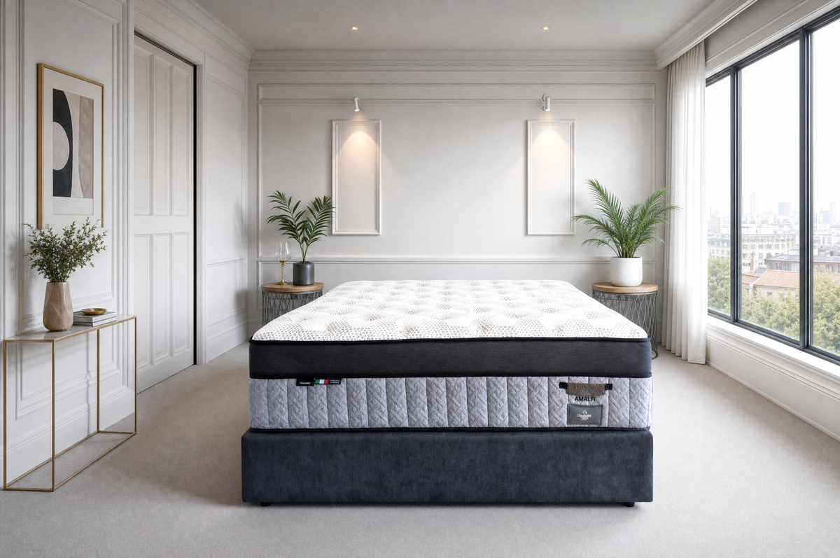 Platinum Luxe Amalfi mattress on a dark upholstered base