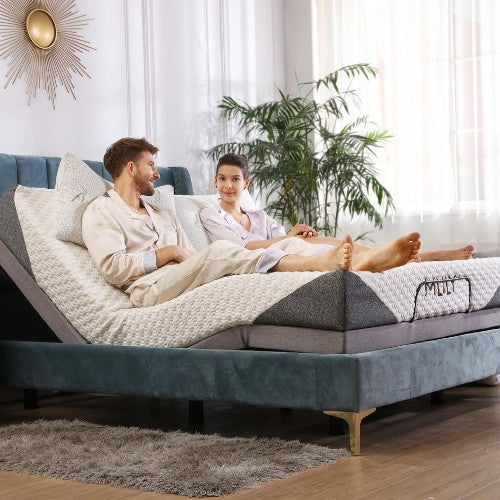 Couple relaxing on an Mlily adjustable bed with head and feet raised