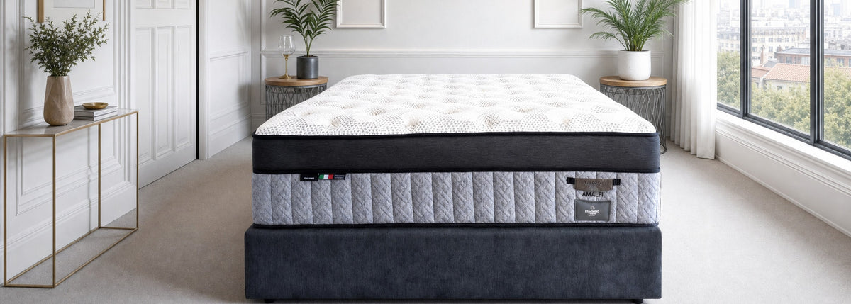 Platinum Luxe Amalfi mattress on a charcoal base in a bright bedroom